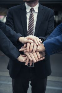 Group of Business Partners Team with hands together. People with